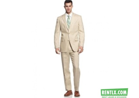A light cream color linen-club suit on rent