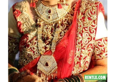 Red & Golden bridal lehenga for rent In Pune